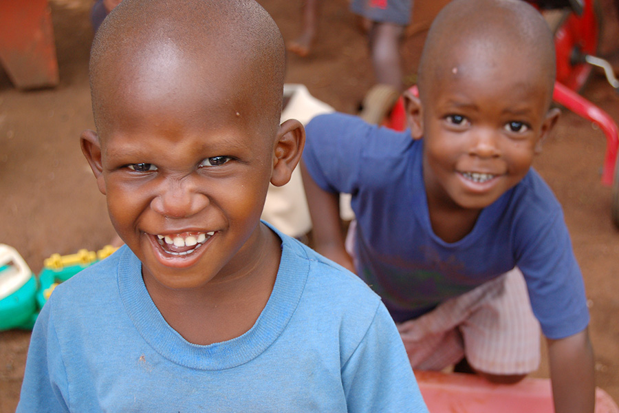 two young boys smile for photo