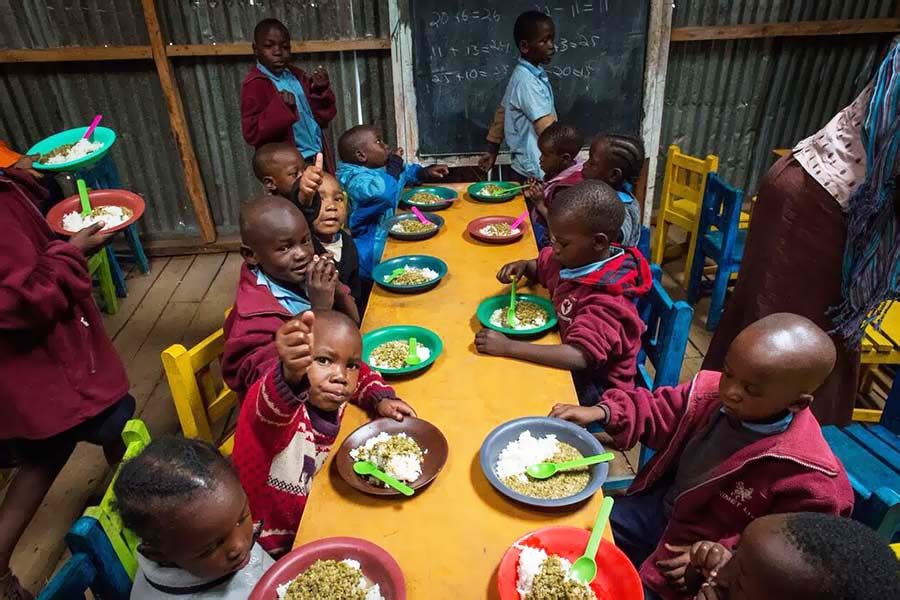 group of young children seated at table for dinner