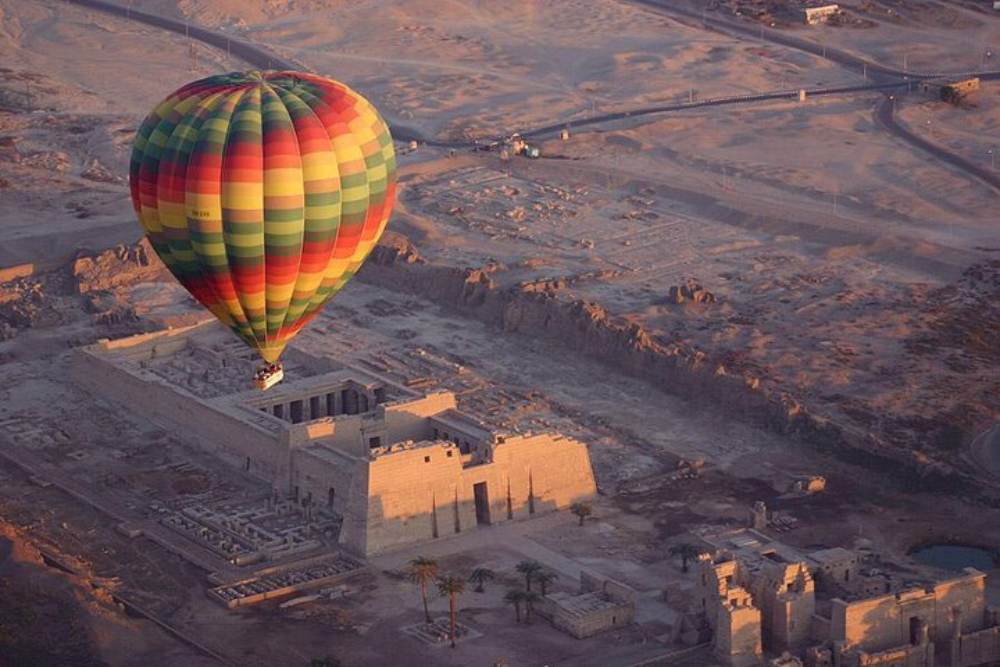 Hot Air Balloon flying over pyramids